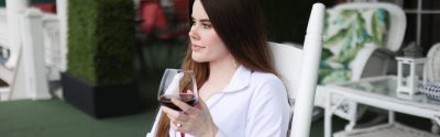 Woman enjoying glass of red wine