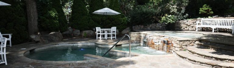 Outdoor pool and hot tub at The Martha